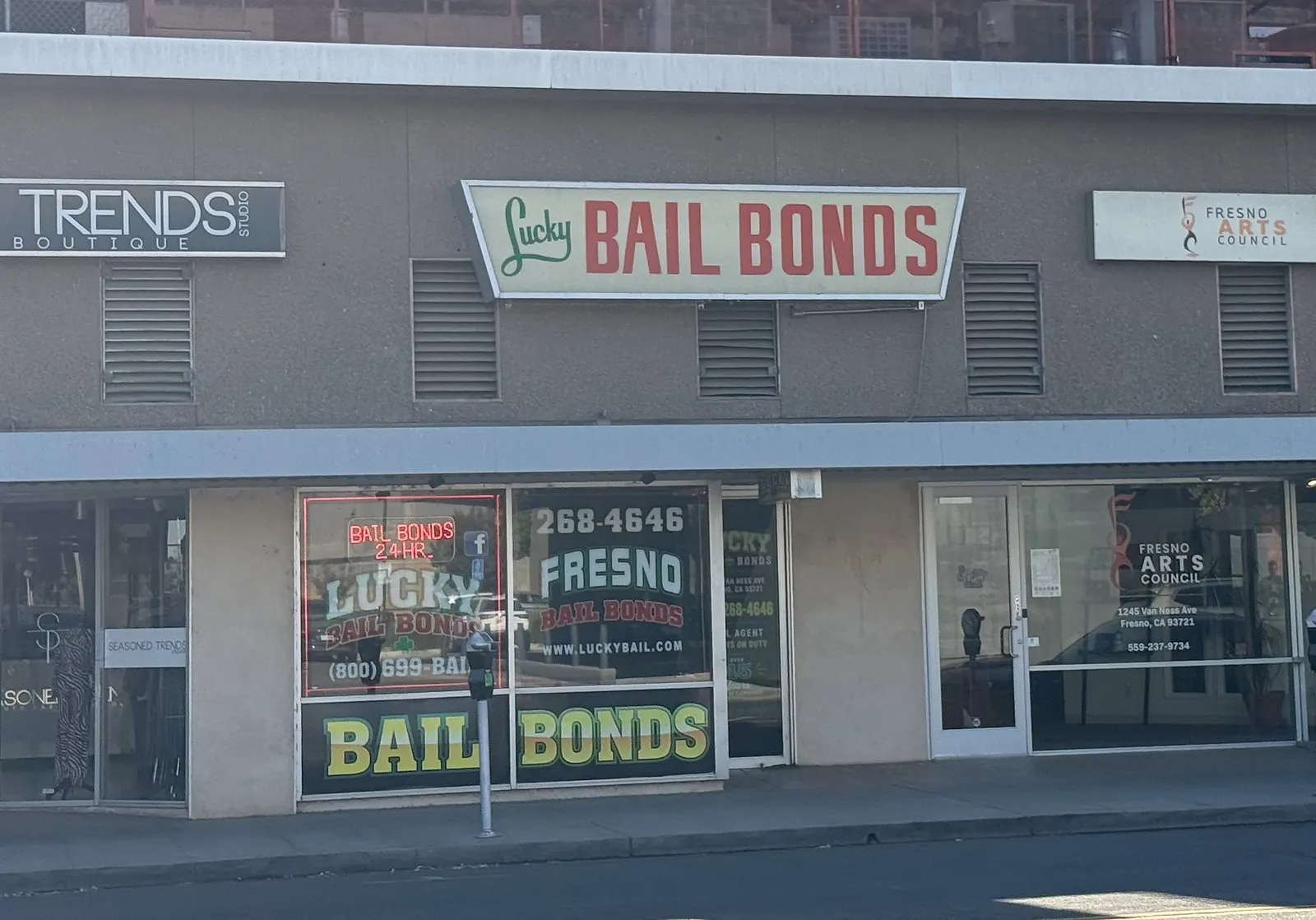 The Lucky Bail Bonds storefront and overhead sign on Van Ness Avenue in Fresno